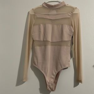 Long sleeve, see through body suit.